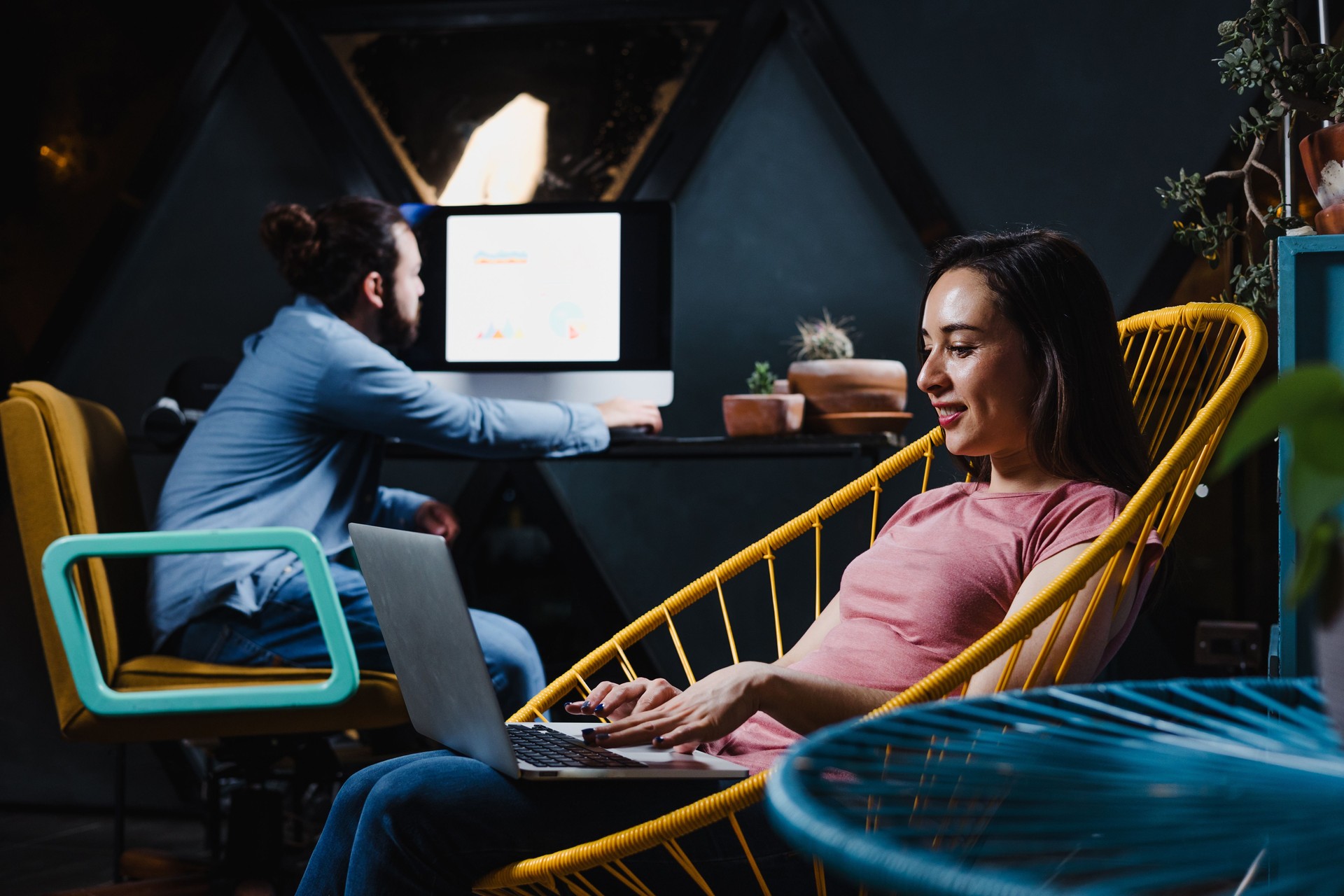 latin young couple working online and using computer and laptop for homework at home at night in Mexico Latin America, hispanic people