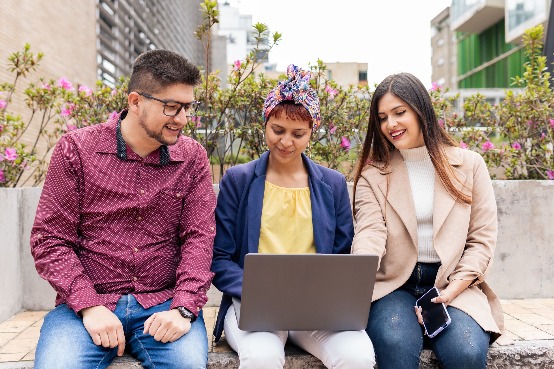 a Latin mid adult man and two women
